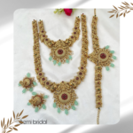 Semi-Bridal Set with Beautiful Pink Stone Flowers, White Stone Pendant, and Lakshmi & Peacock Design