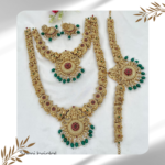 Semi-Bridal Set with Pink Stone Flowers, White Stone Pendant, Lakshmi & Peacock Design, and Green Pearls