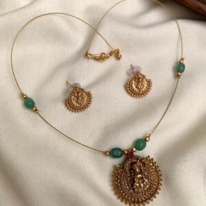 INVISIBLE GREEN BEAD WITH LAKSHMI PENDANT