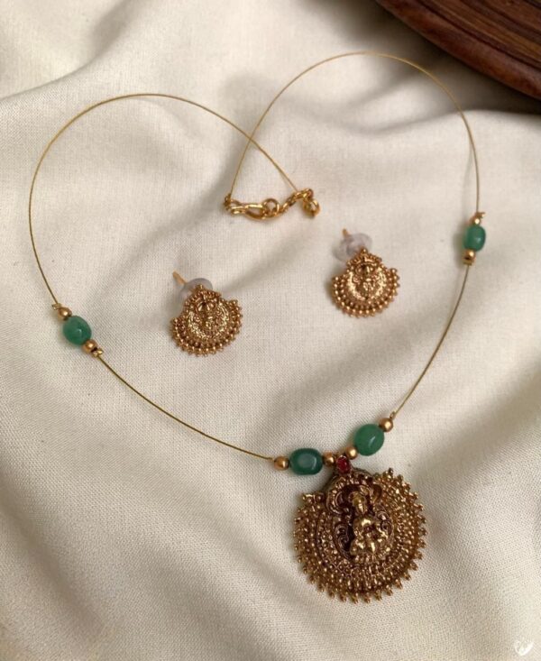 INVISIBLE GREEN BEAD WITH LAKSHMI PENDANT