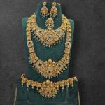 HEAVY WHITE STONE MIXED LAKSHMI COMBO IN ANTIQUE LOOK ( GREEN BEADS HANGING )