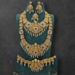 HEAVY WHITE STONE MIXED LAKSHMI SEMI BRIDAL IN MINT GREEN HANGING